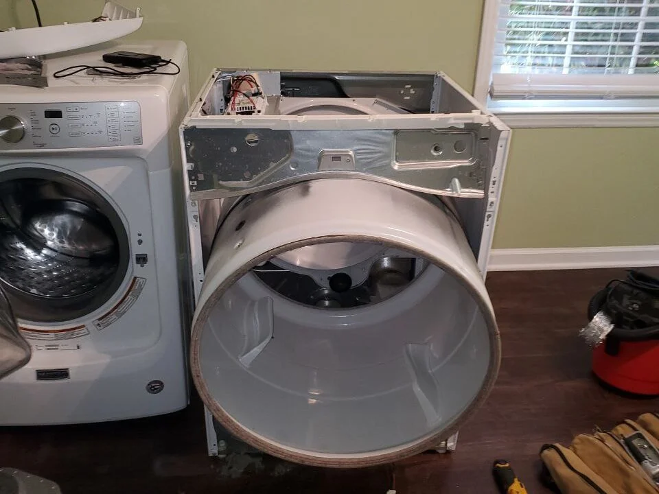 Frustrated person attempting DIY dryer repair (16:9)